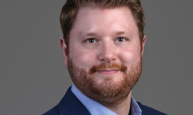 REED POPE LAWYER BRANDON DEANS AIMS TO KEEP CORPORATE LEGAL WORK ON THE ISLAND